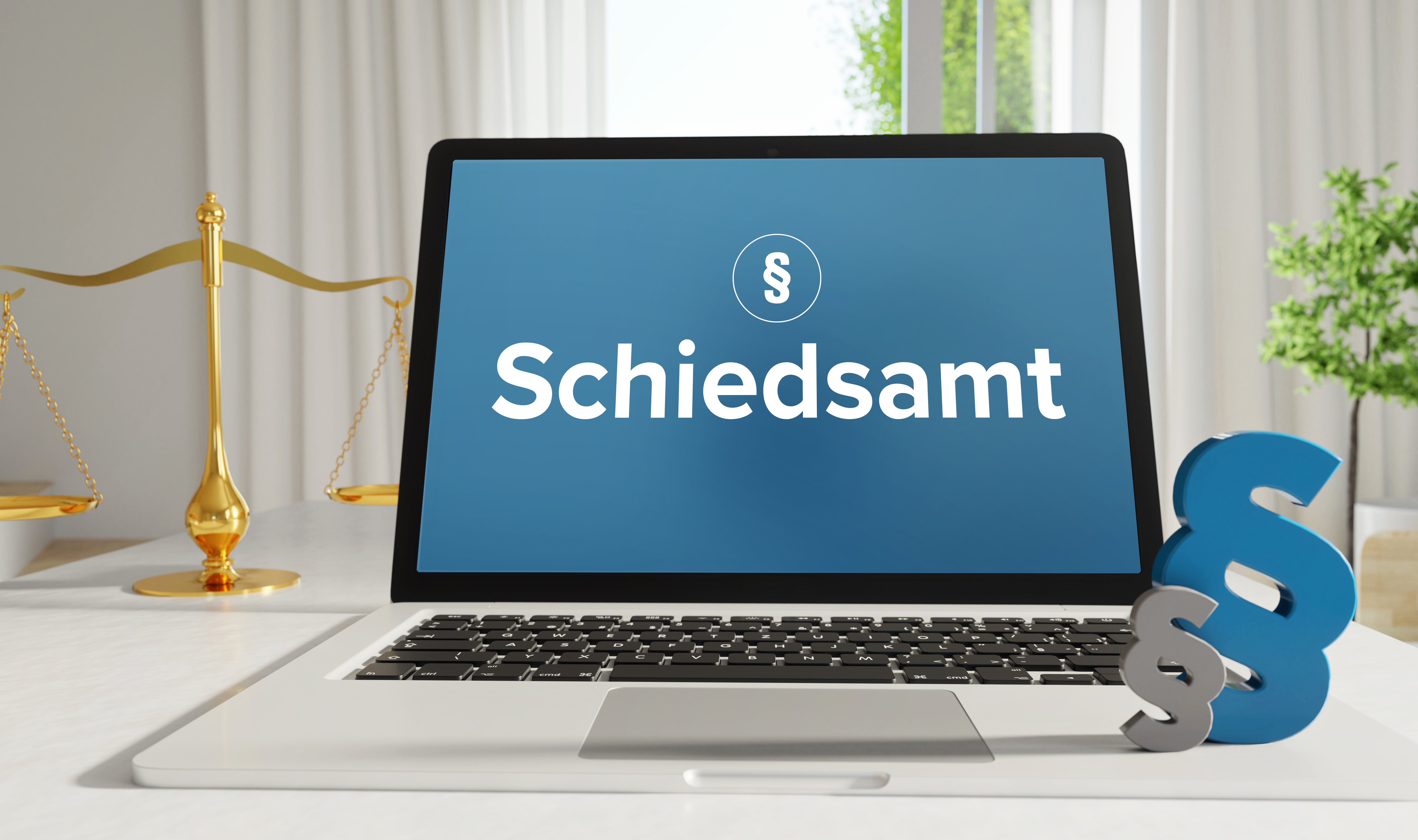Ein Laptop mit dem Wort Schiedsamt auf dem Bildschirm.