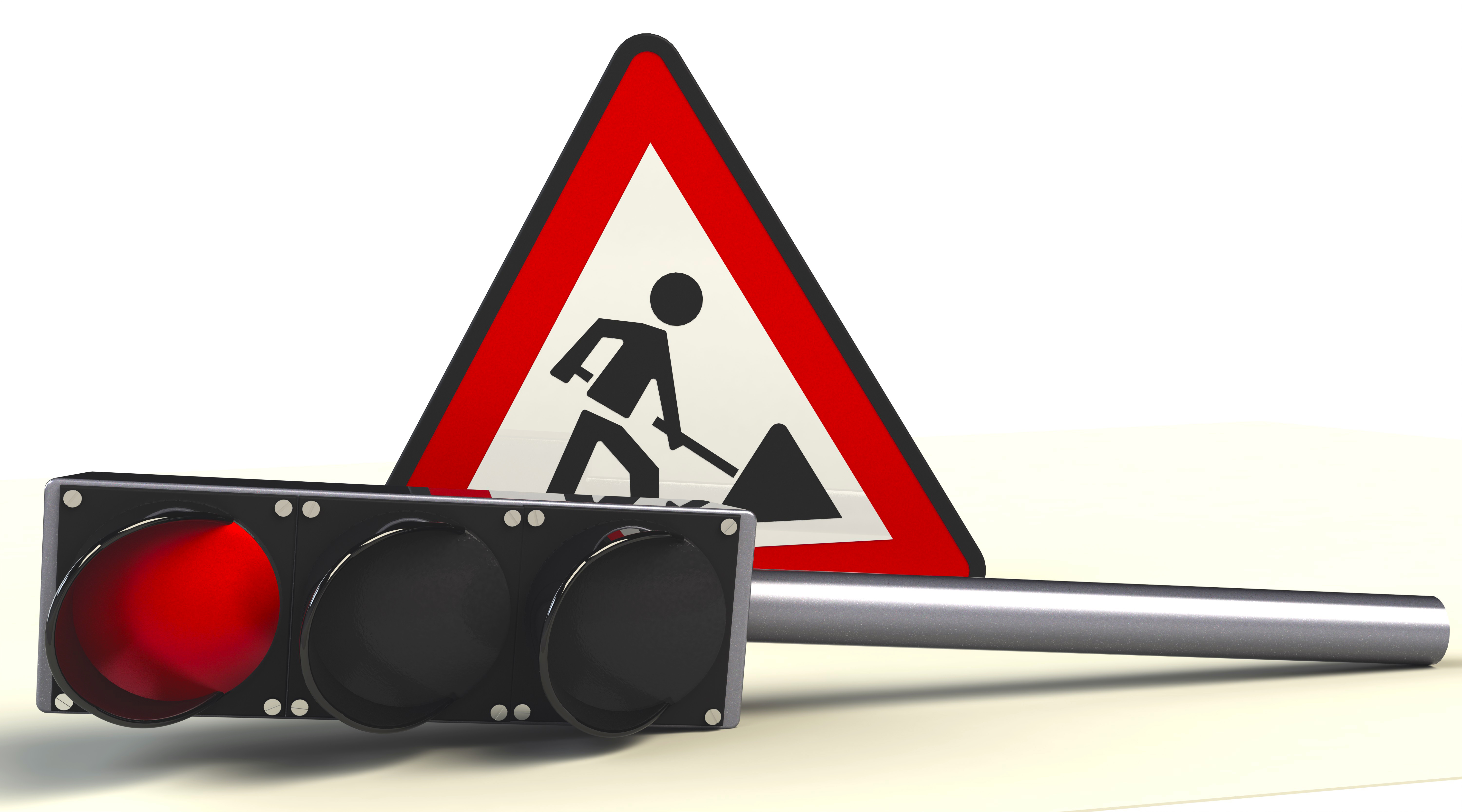 Foto einer liegenden Ampel mit Rotlicht und des Verkehrsschilds "Achtung Baustell"